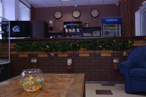a bar with a fish bowl on a table at Karavella in Mykolaiv