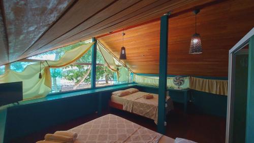 Voodi või voodid majutusasutuse Monkey beach agroturismo toas