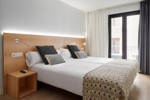 Postel nebo postele na pokoji v ubytování Hostal Arriazu