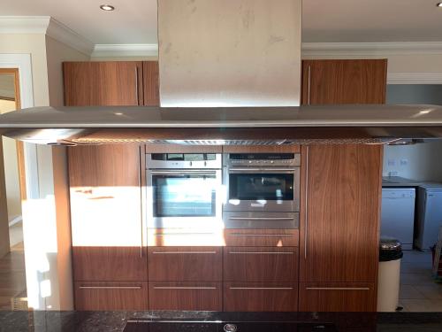 a kitchen with a counter top and a oven at Rohallian in Stanley