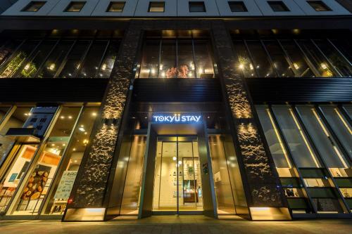 a view of a tory tokyo city building at night at Tokyu Stay Ginza in Tokyo