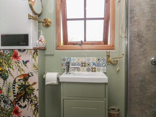 a bathroom with a sink and a window at Keets at Middle Acre in Dorchester