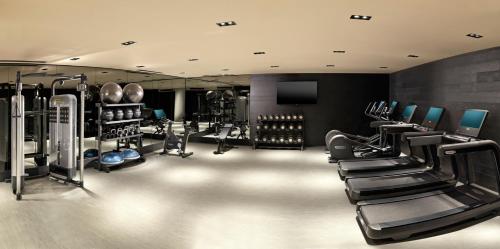 a gym with several treadmills and cardio machines at Nobu Hotel Chicago in Chicago