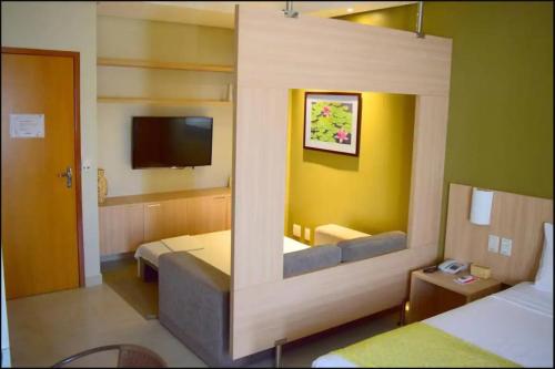 Ένα ή περισσότερα κρεβάτια σε δωμάτιο στο Hotel HotSprings Caldas Novas-GO