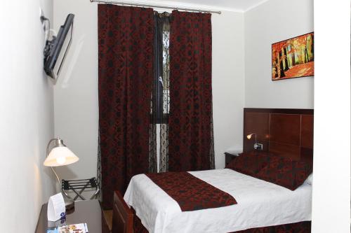 Ένα ή περισσότερα κρεβάτια σε δωμάτιο στο Hotel LB Lebrija by MA 22 Puntos
