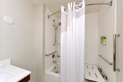 a bathroom with a shower curtain and a sink at Holiday Inn Express Lodi, an IHG Hotel in Lodi