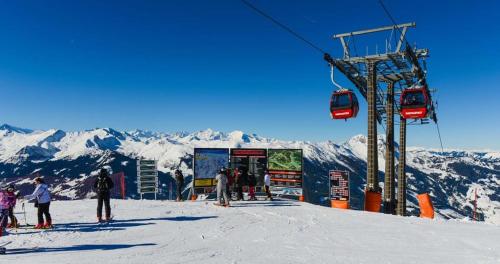 a group of people on a ski lift on a mountain at Gästehaus Hagenhofer in Dorfgastein