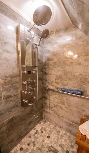 a shower with a shower head in a bathroom at Casablanca Inn on the Bay in Saint Augustine