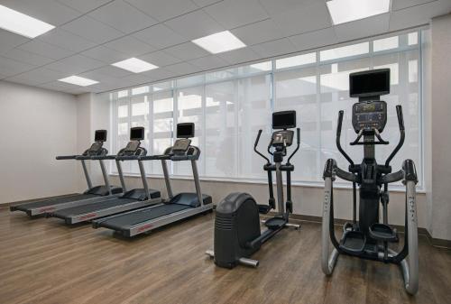 a gym with several tread machines in a room at Holiday Inn Express - Milwaukee Downtown by IHG in Milwaukee