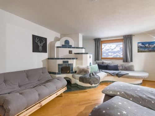 a living room with a couch and two couches at Apartments Gondelspaß in Fügen