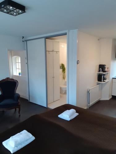 a room with a bed and a sliding glass door at B&B ByBoukje in Eernewoude