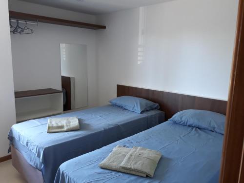En eller flere senge i et værelse på Village Praia do Surf, Itacimirim - Camaçari, BA