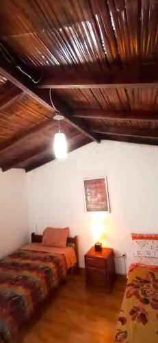 Postel nebo postele na pokoji v ubytování La Viña de OsCar