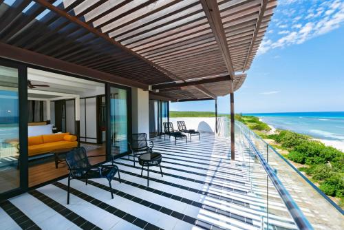 an outdoor deck with a view of the ocean at Ocean Coral Spring Resort - All Inclusive in Falmouth