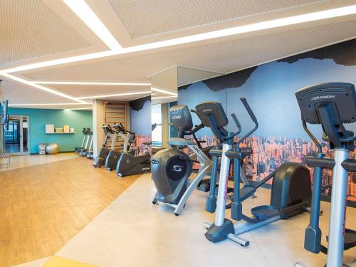 a gym with several tread machines in a room at Novotel São Paulo Berrini in Sao Paulo
