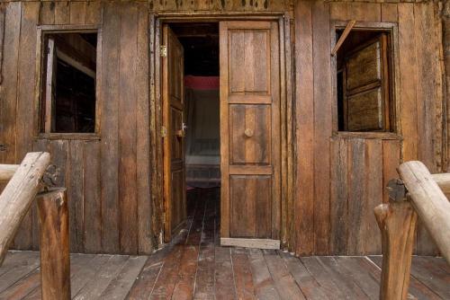 an open wooden door in a wooden house at Room in BB - Mida Creek Eco Camp community project,Mida Creek Watamu Kilifi County 