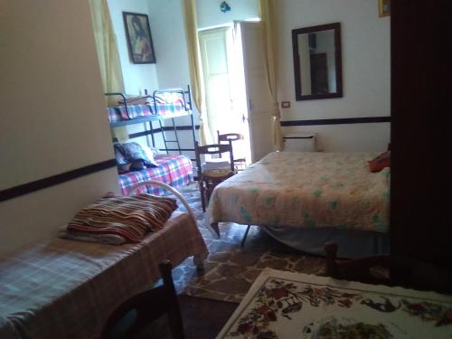 A bed or beds in a room at Room in Guest room - Room with Etna view