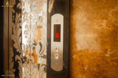 a close up of a remote control on a wall at Sea Star Hotel Quy Nhon in Quy Nhon