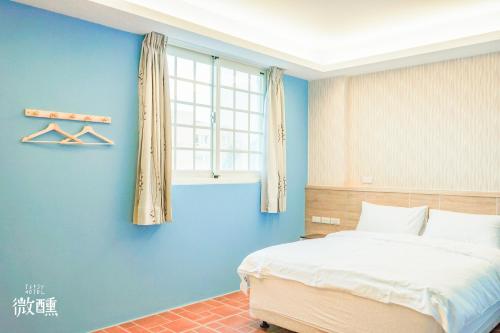 Postel nebo postele na pokoji v ubytování 金門微醺民宿 Kinmen TipsyHotel B&B