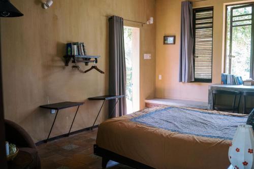 Una cama o camas en una habitación de An Villa boutique resort