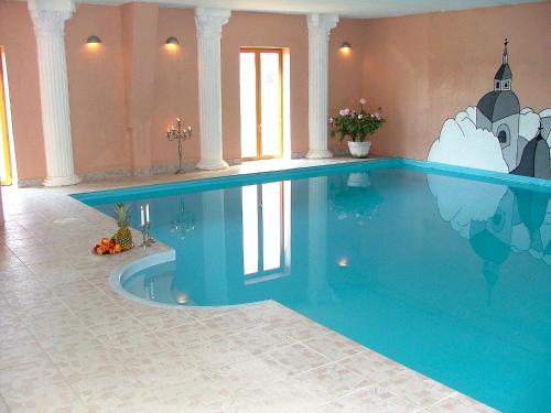 a large swimming pool in a house with a large pool at 26 person holiday home in Lunderskov in Lunderskov