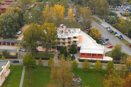 an aerial view of a building in a city at Csipke Hotel in Kiskunhalas