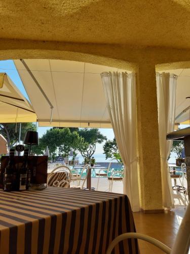 a table with a black and white striped table cloth at Hotel San Marco in Bardolino
