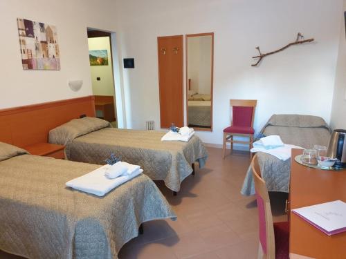 Ένα ή περισσότερα κρεβάτια σε δωμάτιο στο Casa Vacanze Orchidea