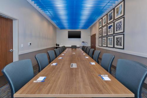 a conference room with a long table and chairs at Holiday Inn Express- Eau Claire West I-94 by IHG in Eau Claire