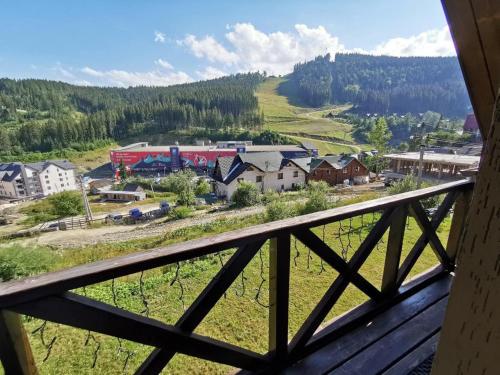 a view of a town from the balcony of a house at Salut in Bukovel
