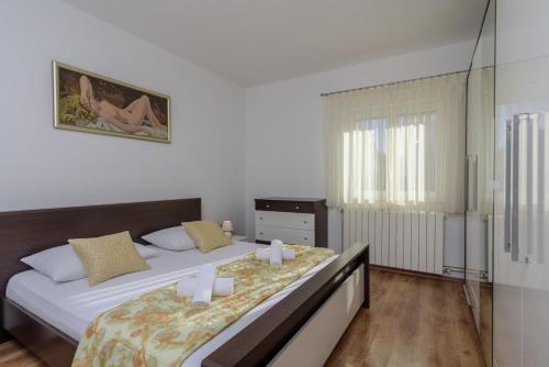 Postel nebo postele na pokoji v ubytování Apartments Meri
