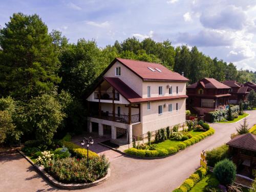 an aerial view of a house with a driveway at Eco-hotel Lel' in Ufa