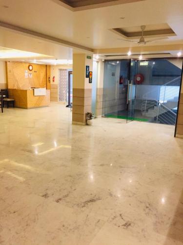 an empty room with a lobby with a glass door at Mayda Inn- A Boutique Hotel in New Delhi