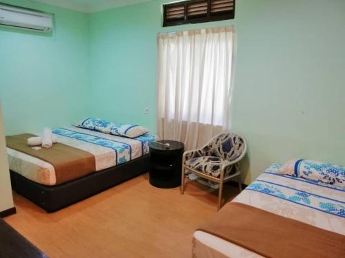 Krevet ili kreveti u jedinici u okviru objekta chalet aircond RM50 homestay aircond RM100 Kakmah pantai timur guest house