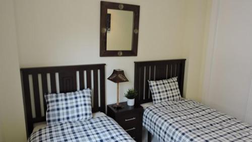 Giường trong phòng chung tại HL 006 Luxury 2 bedroom apartment on HDA Golf Resort, Murcia