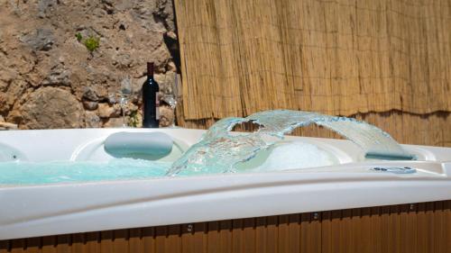 a white bath tub with a water fountain at Ankora apartments sea and Old Town view - HOT TUB in Dubrovnik