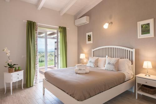 Postel nebo postele na pokoji v ubytování Podere n°8 Agriturismo in Maremma