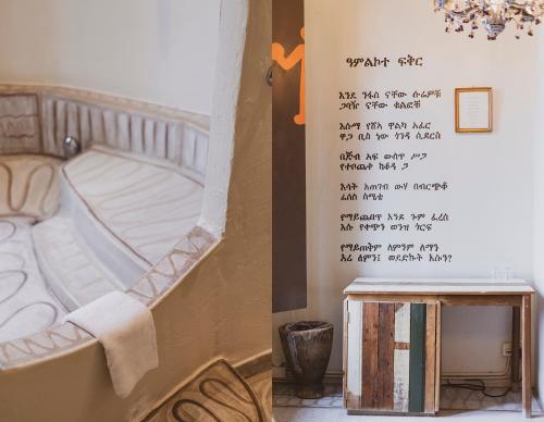 a bedroom with a bed with a writing on the wall at Hotel Bazar in Rotterdam