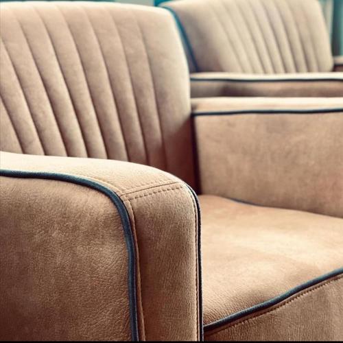 a close up of the back of a leather couch at Hagen`s Hotel "eat & meet" Restaurant Bar Lounge in Haren