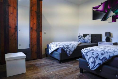 מיטה או מיטות בחדר ב-HT Appartement Nr 2