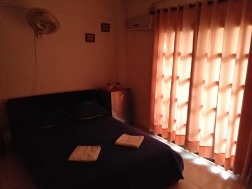 En eller flere senge i et værelse på Comfort La Española