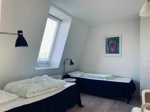 Ένα ή περισσότερα κρεβάτια σε δωμάτιο στο ApartmentInCopenhagen Apartment 93