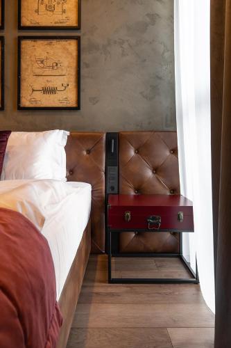 Ein Bett oder Betten in einem Zimmer der Unterkunft Potocki Boutique Hotel