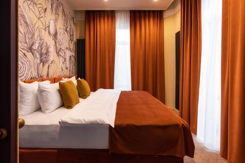 Ein Bett oder Betten in einem Zimmer der Unterkunft Potocki Boutique Hotel