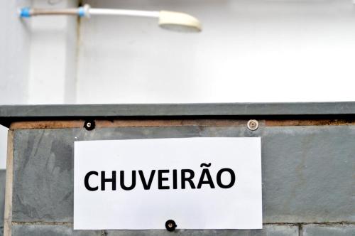 a sign that says chuengota hanging on a wall at Cantinho da Geisa - suítes mobiliadas in Bertioga