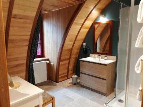 a bathroom with a sink and a mirror at Hotel La Diligence in La Ferté-Saint-Cyr
