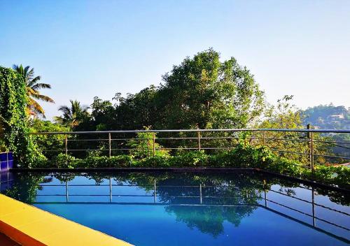 a view of a swimming pool on a house at Jasmin Hill House in Kandy