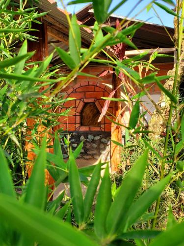 a building with a brick oven in front of it at CASA BLANCA HORTENCIA in Sucúa