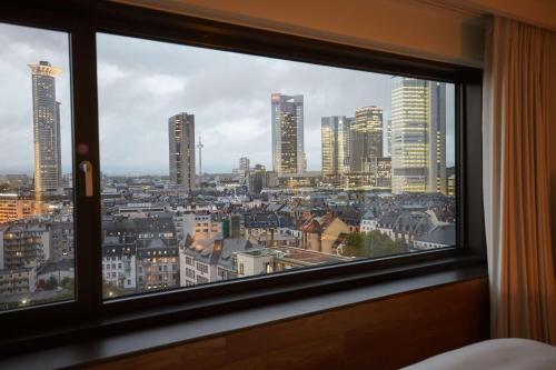 a view of a city from a window at Scandic Frankfurt Museumsufer in Frankfurt/Main