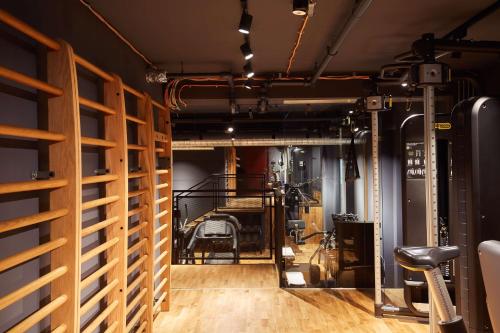a room with a gym with wooden walls and a mirror at Scandic Frankfurt Museumsufer in Frankfurt/Main